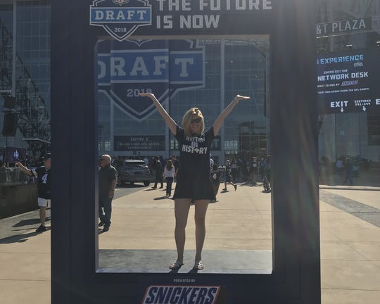 Vice President of Digital Sports Partners standing beneath Dallas Cowboys AT&T Stadium 